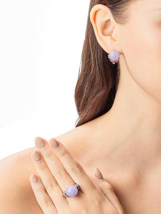 Model wearing purple jade earrings and ring