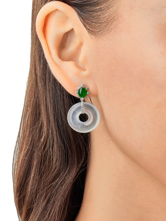 Model wearing green jade stud earrings