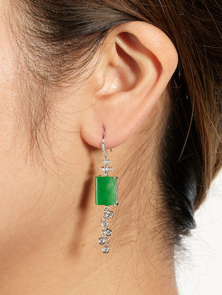 Model wearing jade earrings