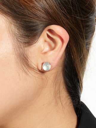Model wearing white jade earrings