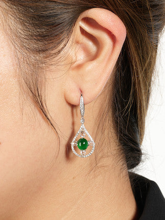Model wearing Heart of the Ocean jade earrings